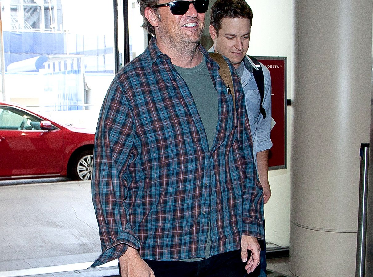 Matthew Perry as he prepares to depart at LAX on August 18, 2013.