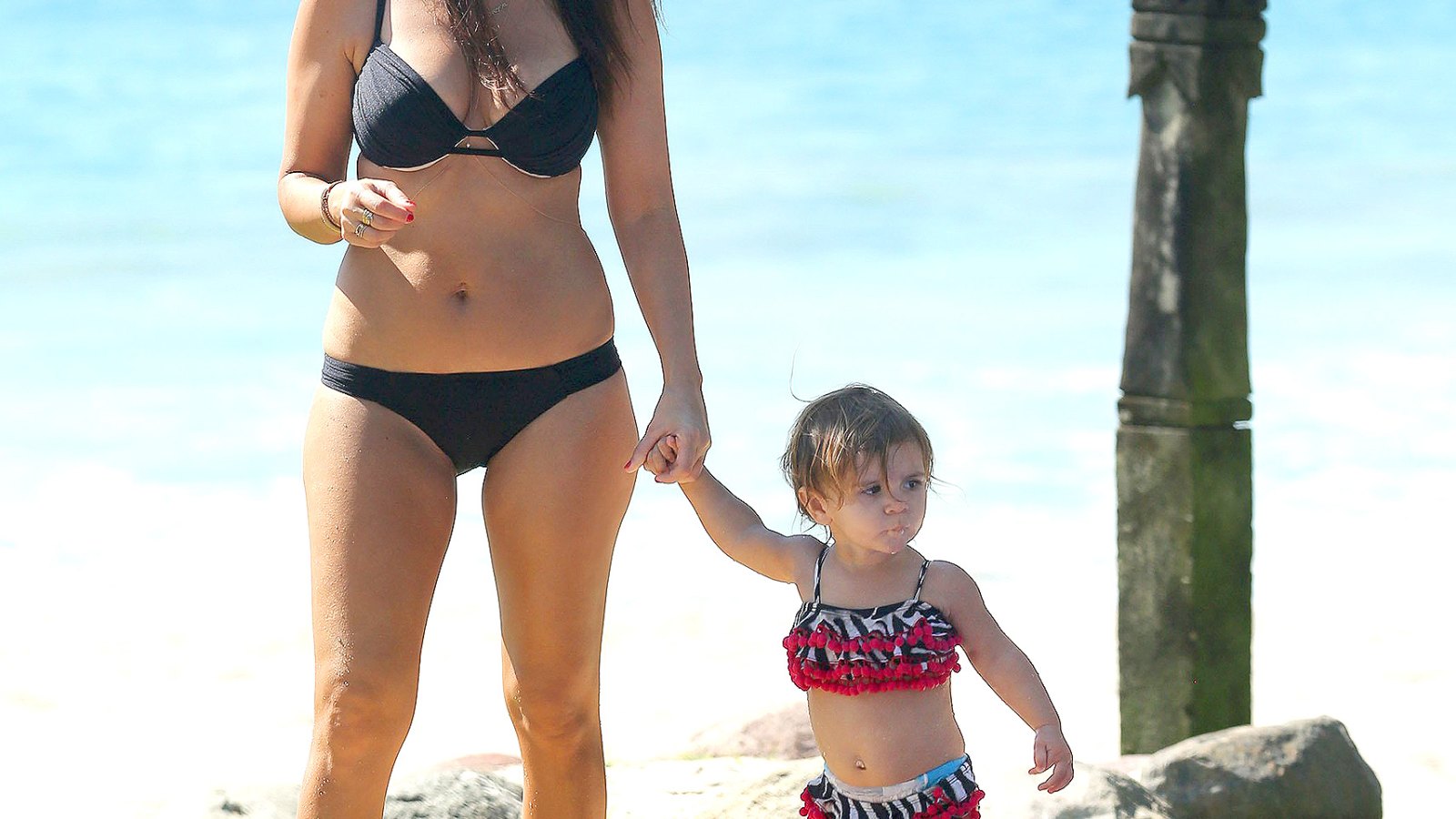 Kourtney Kardashian walks with her daughter Penelope Disick in Mexico