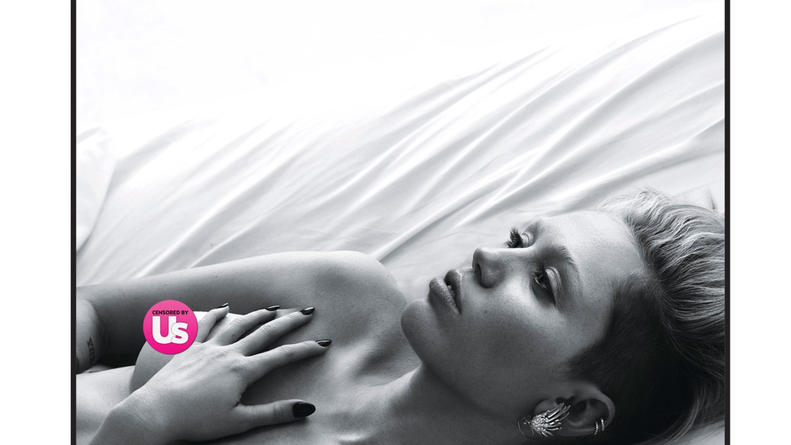 Miley Cyrus poses topless for W magazine