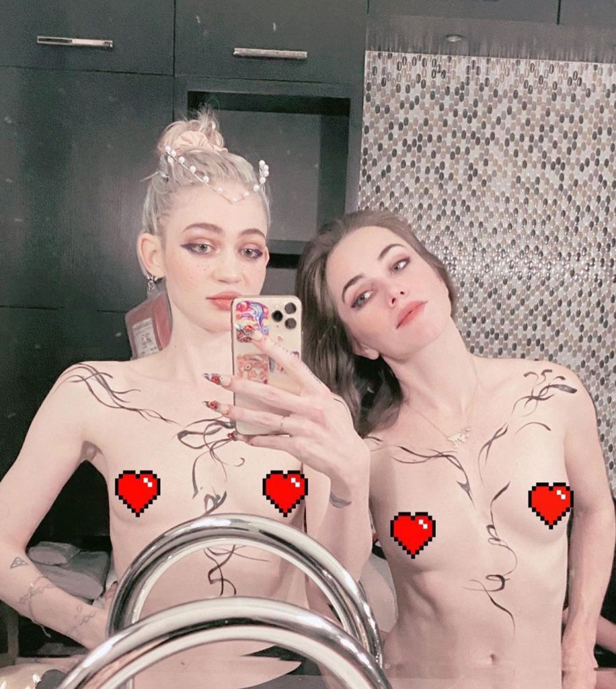 Grimes Poses Topless While Promoting 'Cyberpunk' Video Game