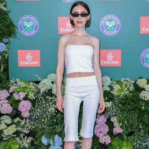 Lily Collins attends as a guest of Emirates, Official Airline Partner of 2026 Wimbledon Championships, at the All England Lawn Tennis and Croquet Club on July 12, 2026 in London, England.