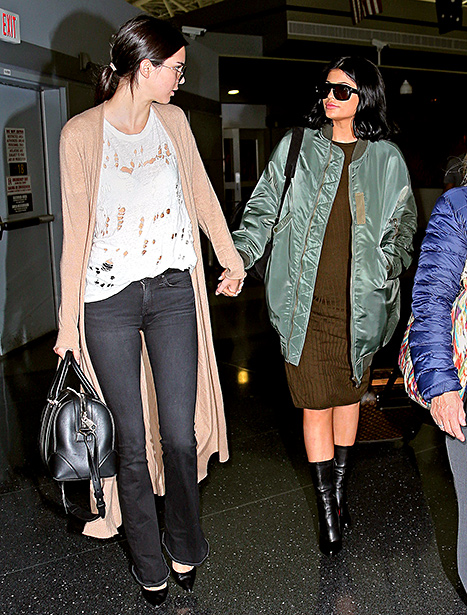 Kendall Jenner and Kylie Jenner hold hands