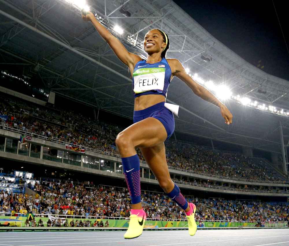 USA's Allyson Felix celebrates winning the Women's 4x400m Relay Final during the athletics event at the Rio 2016 Olympic Games at the Olympic Stadium in Rio de Janeiro on August 20, 2016.