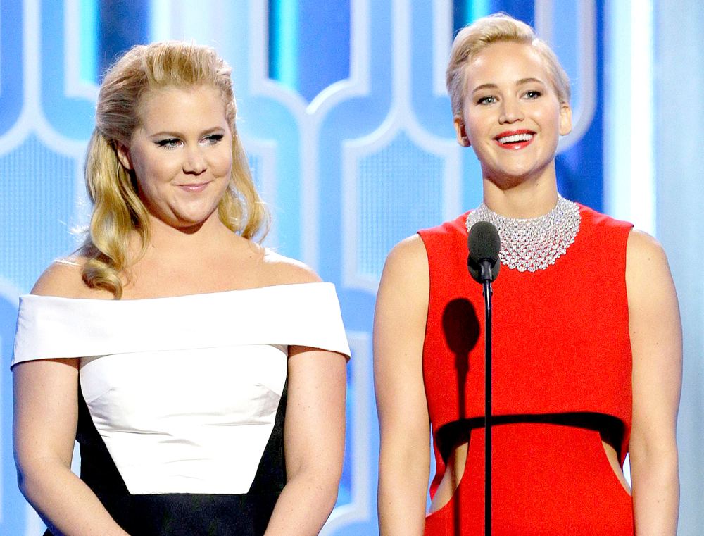 Amy Schumer and Jennifer Lawrence speak onstage during the 73rd Annual Golden Globe Awards at The Beverly Hilton Hotel on January 10, 2016 in Beverly Hills, California.