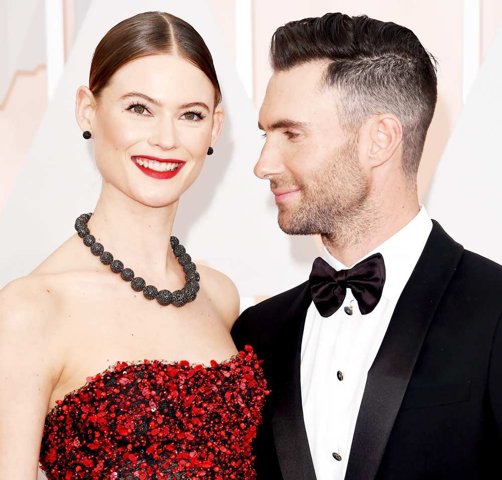 Adam Levine and Behati Prinsloo attend the 87th Annual Academy Awards.