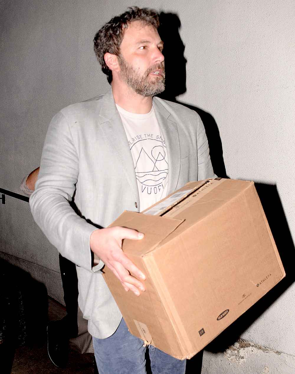 Ben Affleck carrying a box full of gifts leaving his birthday party at Nobu in Beverly Hills through the backdoor.