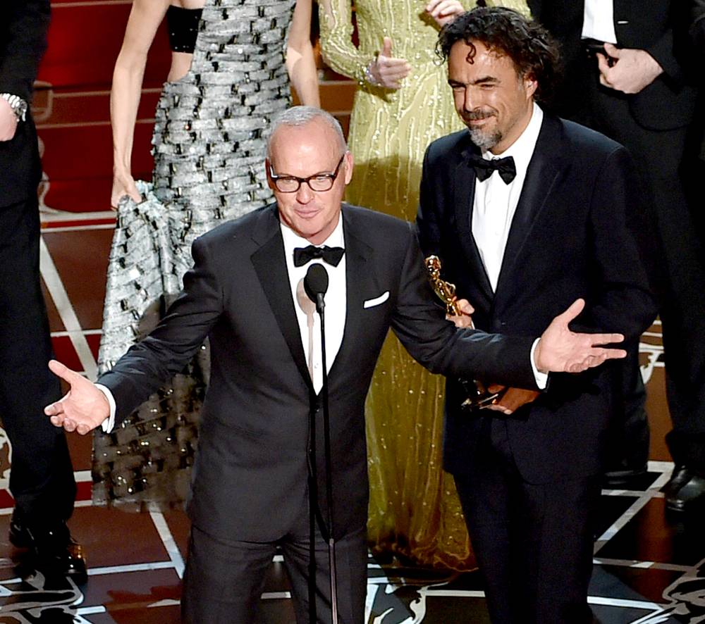 Actor Michael Keaton and director Alejandro Gonzalez Iñárritu accept the Best Picture award for 'Birdman' on stage during the 87th annual Academy Awards.