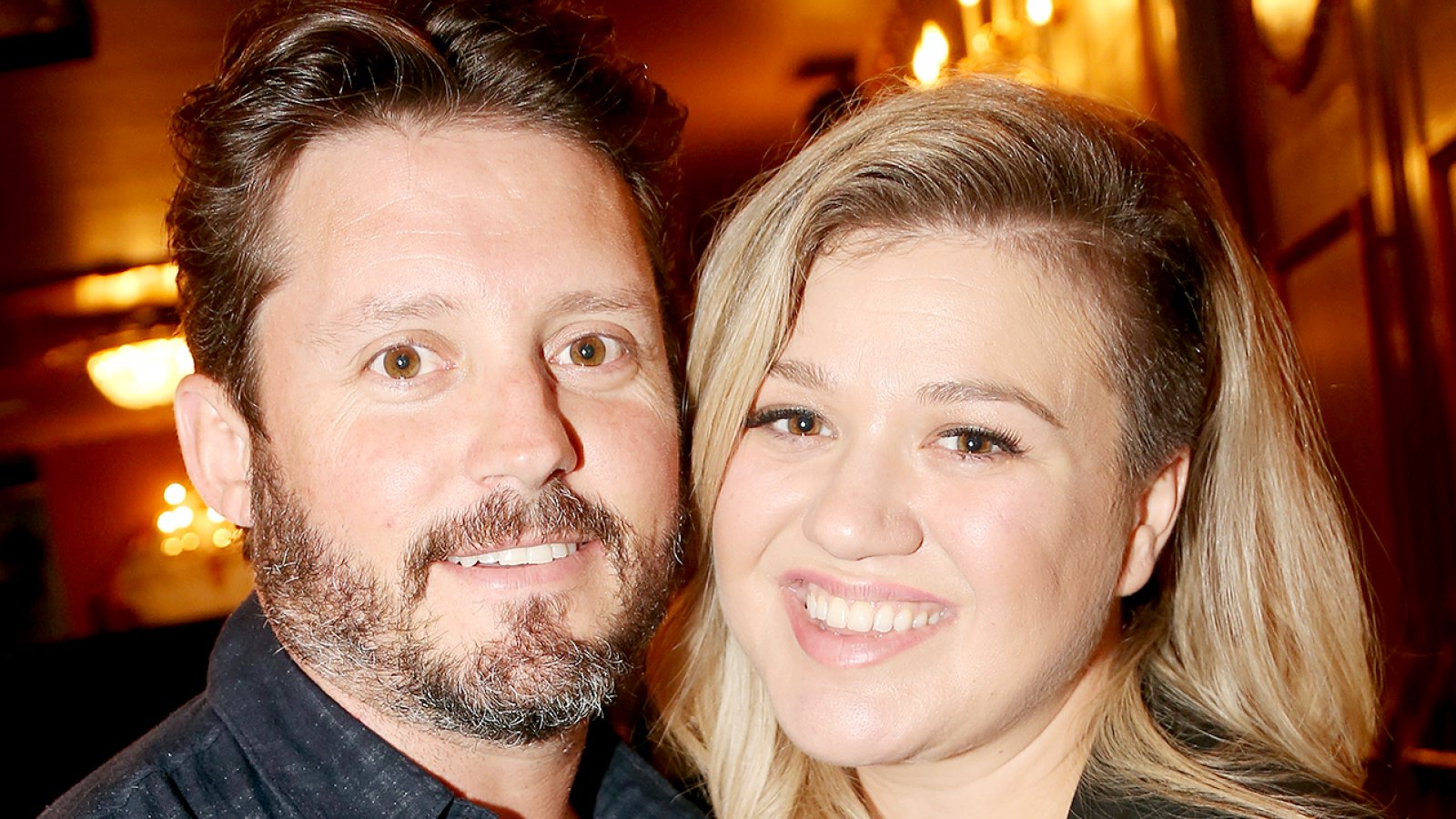 Brandon Blackstock and Kelly Clarkson pose backstage at the hit musical "Finding Neverland" on Broadway at The Lunt Fontanne Theater on July 15, 2015 in New York City.