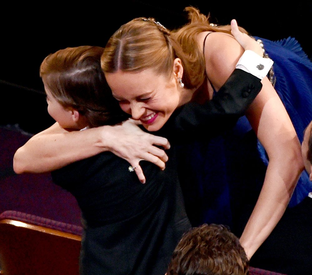 Brie Larson embraces actor Jacob Tremblay after winning the Best Actress award for 'Room' during the 88th Annual Academy Awards.