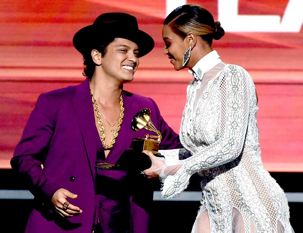 Beyonce (R) presents the Record Of The Year award to recording artist Bruno Mars for 'Uptown Funk' onstage during The 58th GRAMMY Awards at Staples Center on February 15, 2016 in Los Angeles, California.