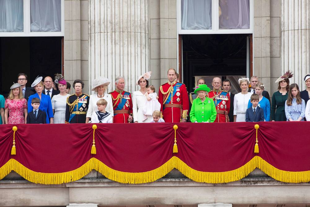 Members of the Royal family and guests stand on the balcony of Buckingham Palace to watch a fly-past of aircrafts by the Royal Air Force, in London on June 11, 2016.