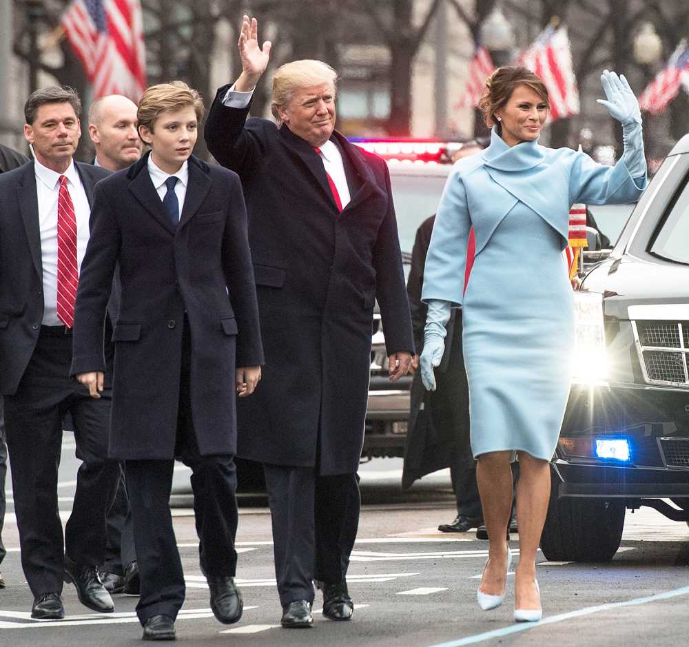 President Donald Trump and first lady Melania Trump, along with their son Barron, walk in their inaugural parade on January 20, 2017 in Washington, DC. Donald Trump was sworn-in as the 45th President of the United States.
