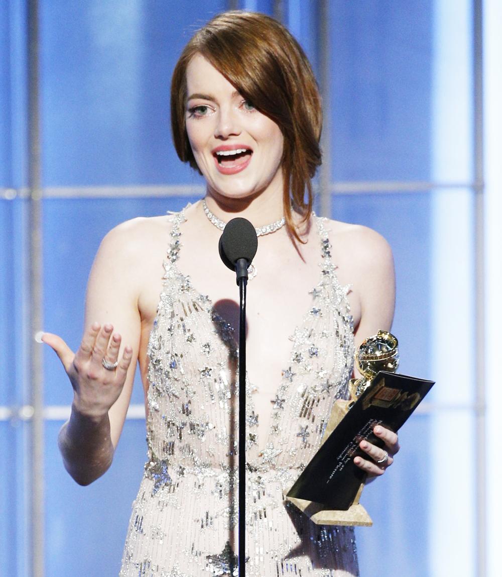 Emma Stone accepts the award for Best Actress in a Motion Picture - Musical or Comedy for her role in