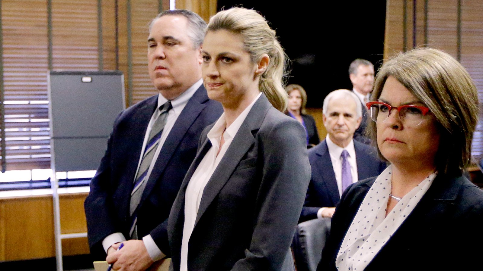 Erin Andrews stands with attorney Scott Carr, second from left, as the jury arrives in the courtroom after reaching a verdict Monday, March 7, 2016, in Nashville, Tenn.