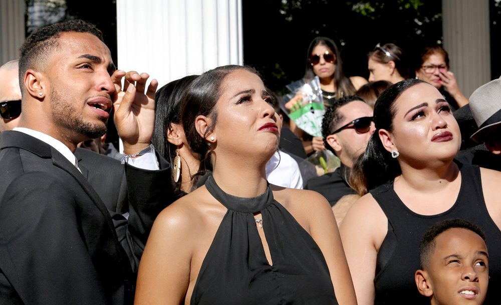 Isaiah Henderson, Tatiana Harris, center, and Khiana Marshall watch 49 white balloons after they were released during the funeral for their mother, Pulse shooting victim Brenda Lee Marquez McCool, at First United Methodist Church in Orlando, Fla., Monday, June 20, 2016.