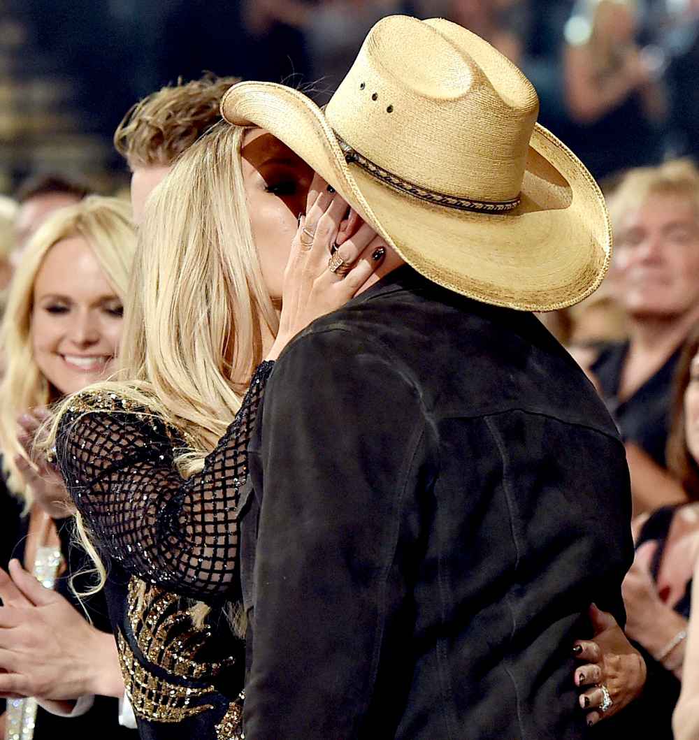 Brittany Kerr and Jason Aldean, winner of the Entertainer of the Year award, embrace at the 51st Academy of Country Music Awards.