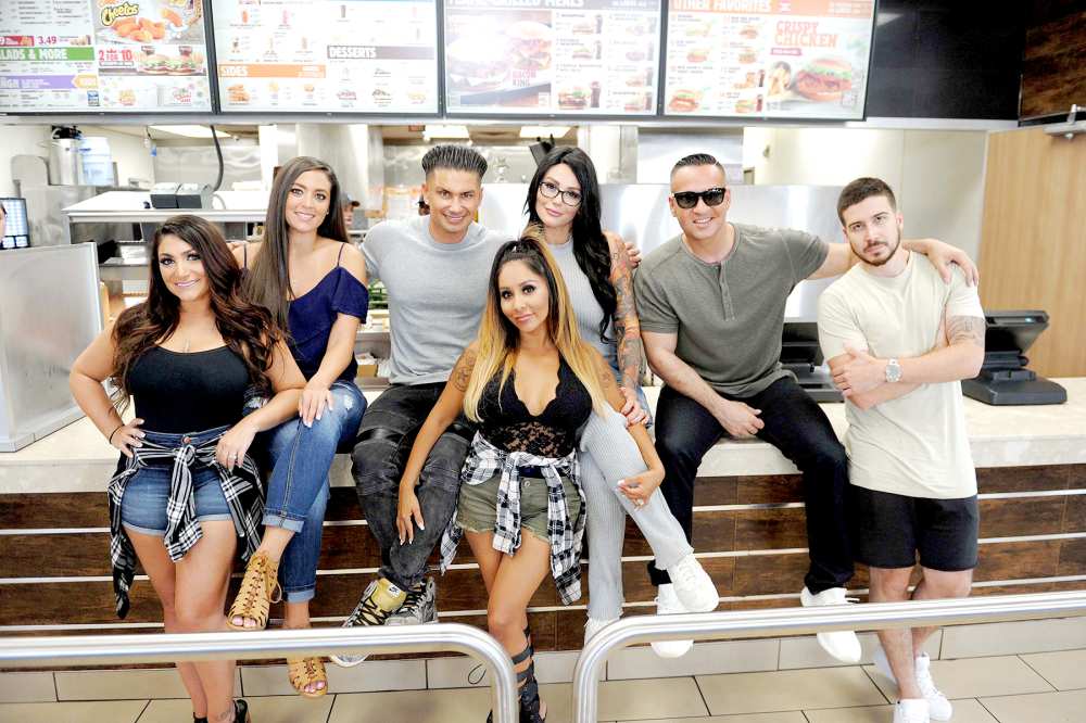 Mike Sorrentino, Nicole Polizzi, Pauly Delvecchio, Jenni Farley, Deena Cortese, Vinny Guadagnino and Sammi Giancola try the new Chicken Parmesan Sandwich at Burger King restaurants on July 11, 2017.