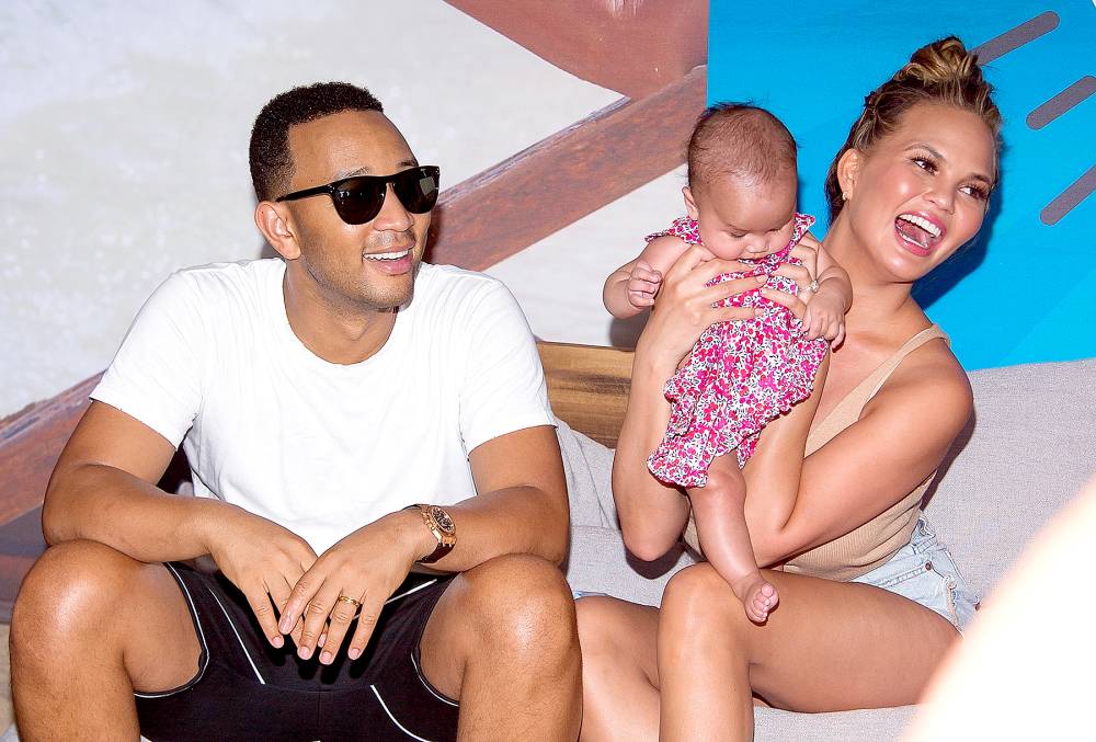Chrissy Teigen and John Legend with their baby Luna Simone Stephens attend the 2016 Sports Illustrated Summer Of Swim Fan Festival & Concert at Ford Amphitheater at Coney Island Boardwalk on August 28, 2016 in Brooklyn, New York.