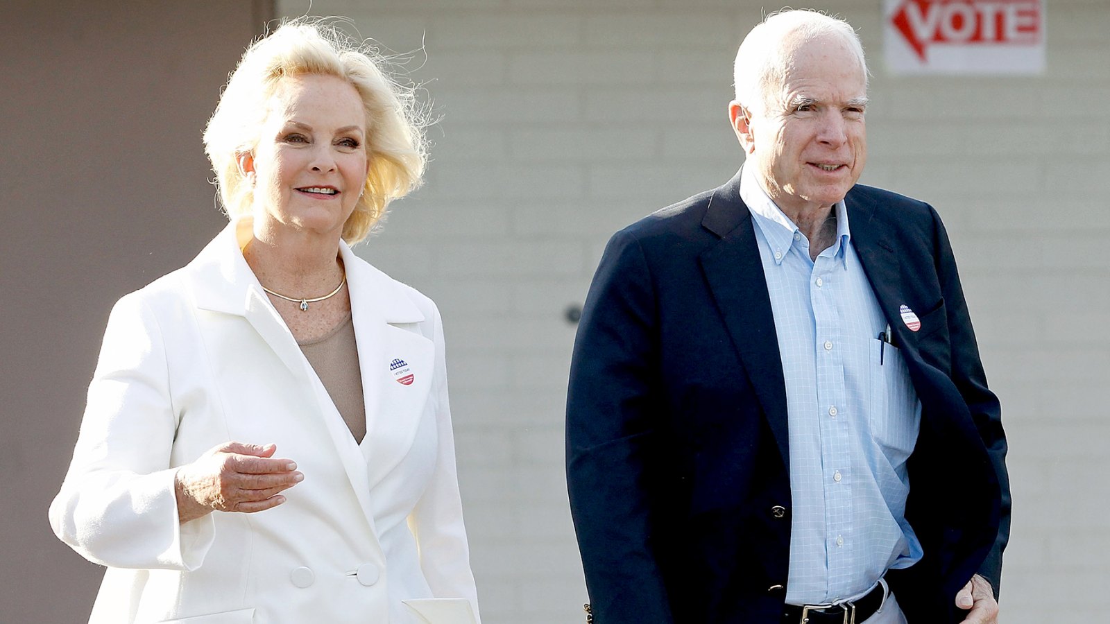 John McCain and his wife Cindy exit the Mountain View Christian Church polling place after casting their vote on November 8, 2016 in Phoenix, Arizona.
