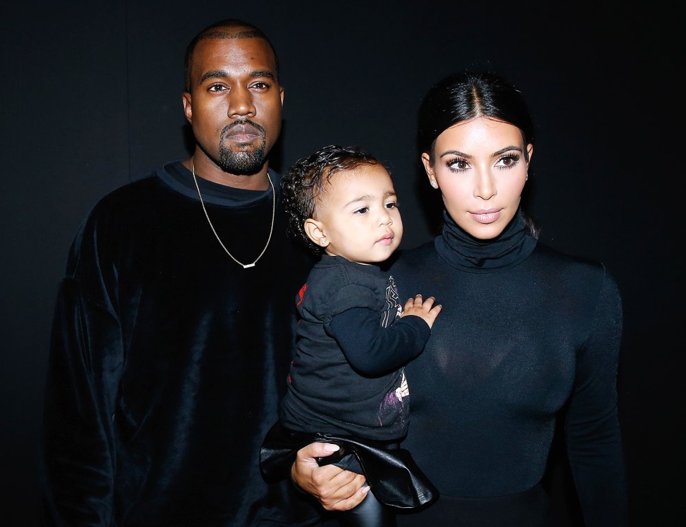 Kanye West and Kim Kardashian with North in 2014