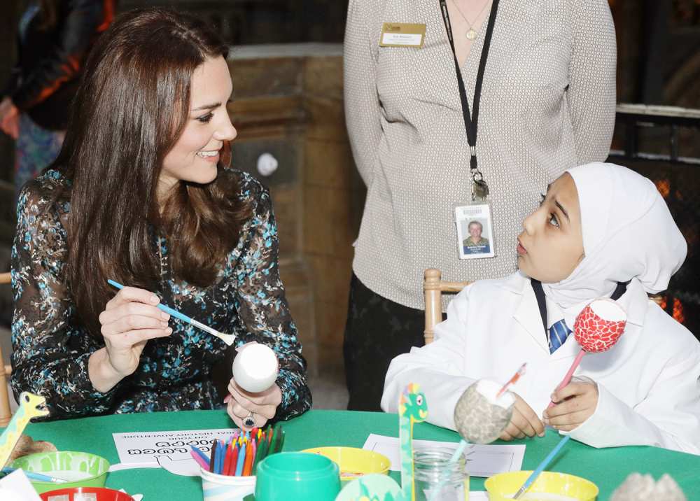 Catherine, Duchess of Cambridge, makes a dinosaur egg with pupils from Oakington Manor Primary School, at the Natural History Museum in London on November 22, 2016, as she atttends a children's tea party to celebrate 'Dippy' the diplodocus's time in the museum's Hintze Hall.