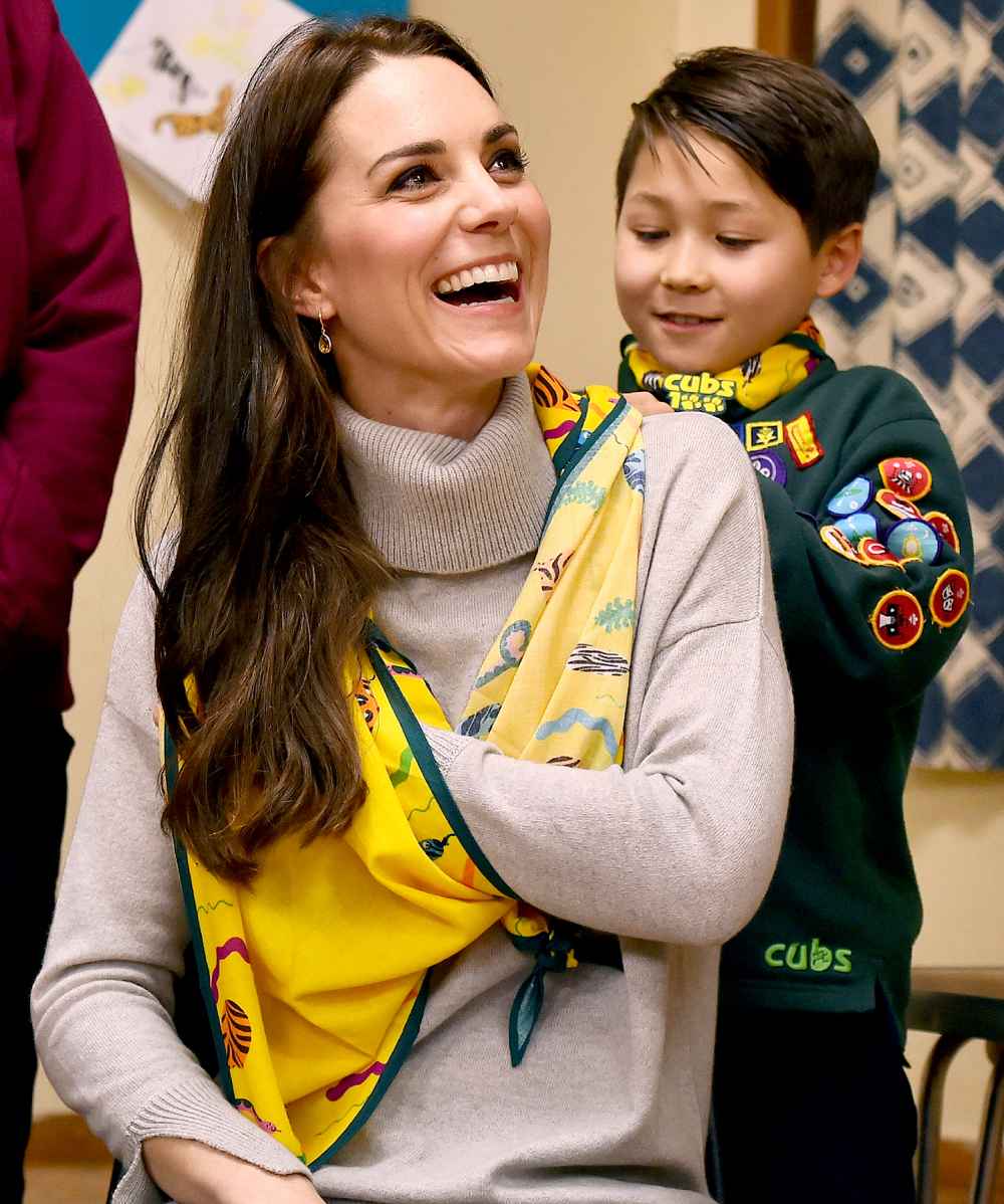 A cub scout uses a neckerchief to show Britain's Catherine, Duchess of Cambridge, how to support a broken arm, during a Cub Scout Pack meeting with cubs from the Kings Lynn District, in Kings Lynn, eastern England, on December 14, 2016, to celebrate 100 years of Cubs. The Duchess attended a special Cub Scout Pack meeting with Cubs from the Kings Lynn District to celebrate 100 years of Cubs. Cub Scouting was co-founded by Robert Baden-Powell and Vera Barclay on the 16th December 1916.