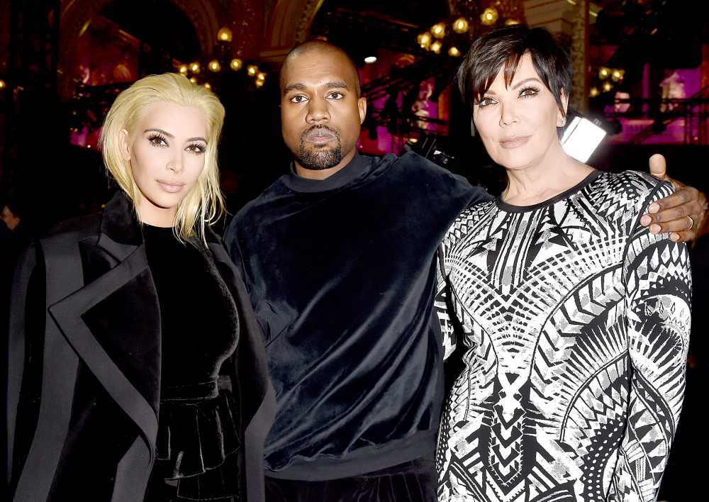 Kim Kardashian, Kanye West, and Kris Jenner attend the Balmain show on March 5.