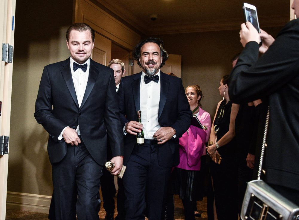 Leonardo DiCaprio and director Alejandro Gonzalez Inarritu in the press room at the Golden Globes 2016