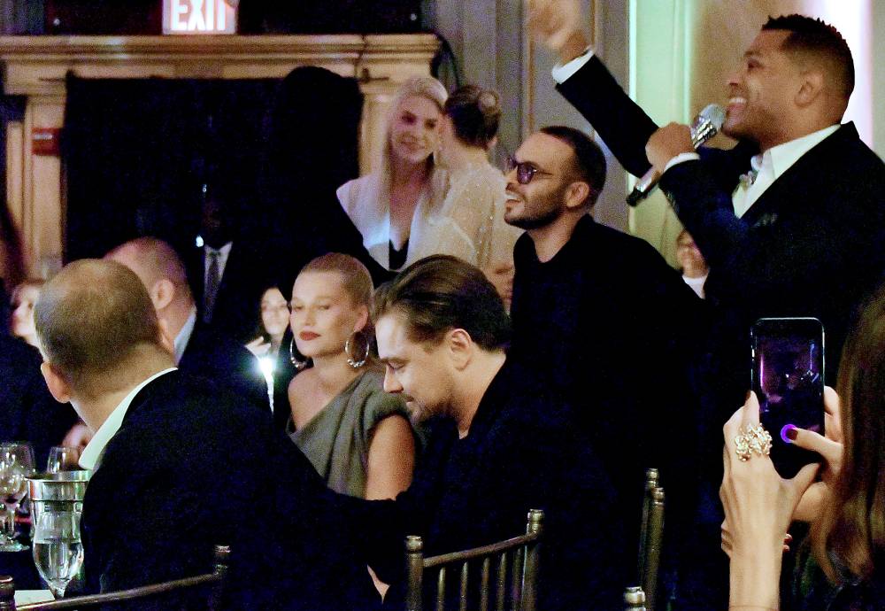 Maxwell (R) performs in front of Leonardo DiCaprio and Toni Garnn at the Unitas Third Annual Gala Against Human Trafficking at Capitale in New York City on September 12, 2017.