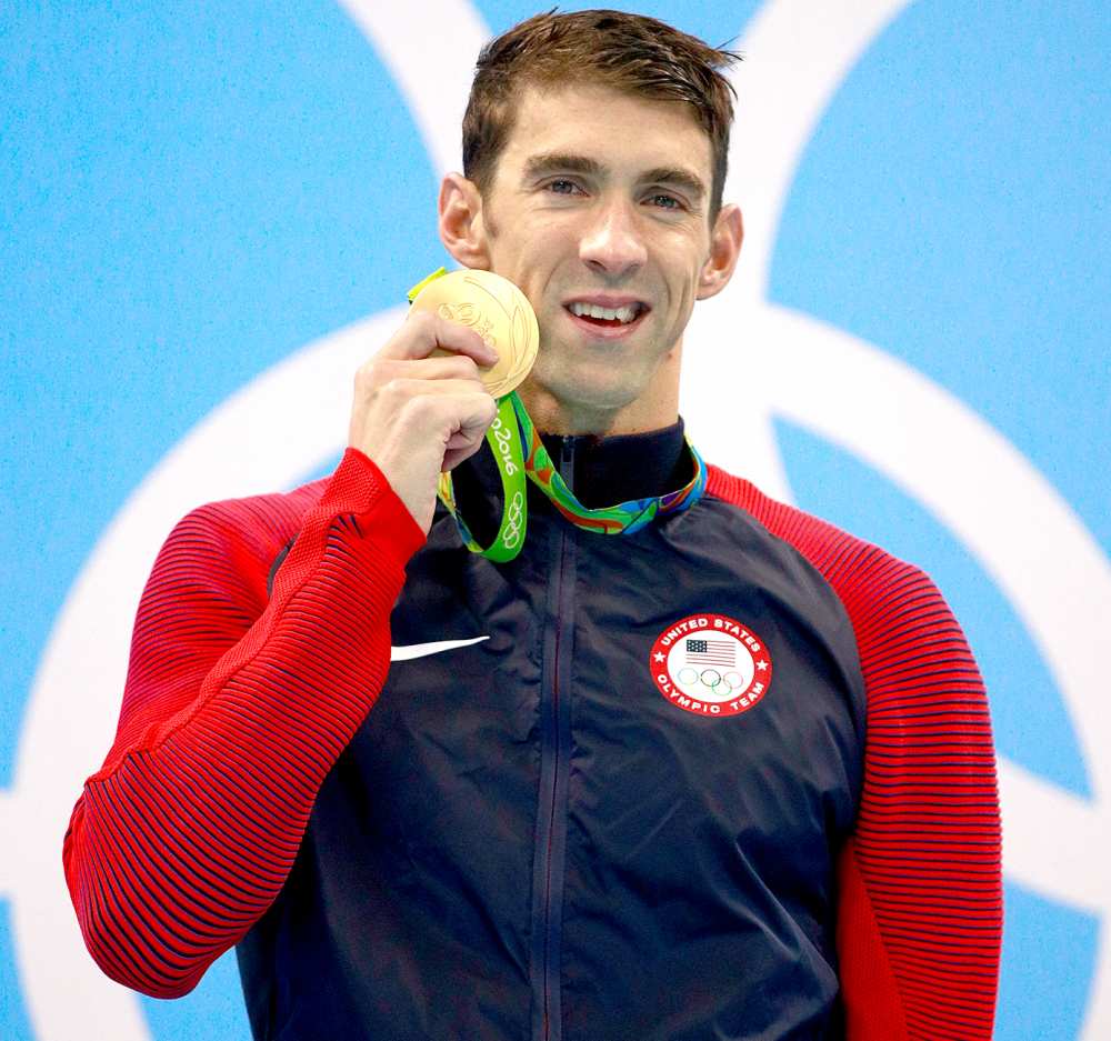 Gold medalist Michael Phelps of the United States poses on the podium during the medal ceremony for the Men's 200m Butterfly Final on Day 4 of the Rio 2016 Olympic Games at the Olympic Aquatics Stadium on August 9, 2016 in Rio de Janeiro, Brazil.