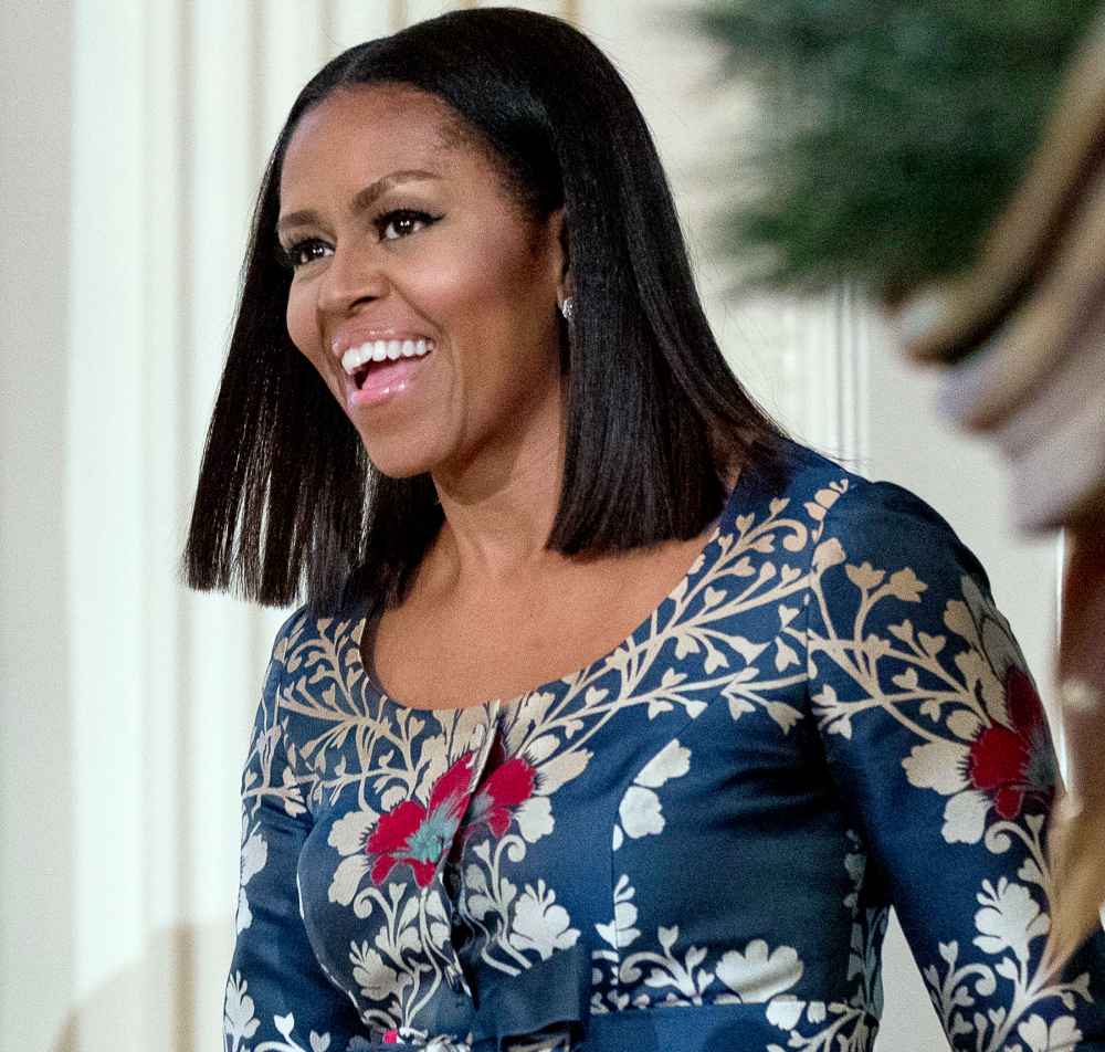 First lady Michelle Obama arrives in the East Room of the White House during a preview of the 2016 holiday decor for military families, Tuesday, Nov. 29, 2016, in Washington.