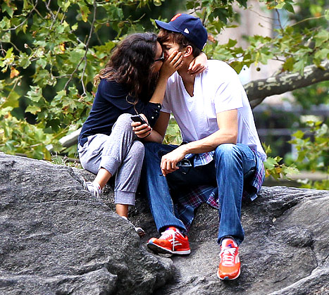 Ashton and Mila kissing