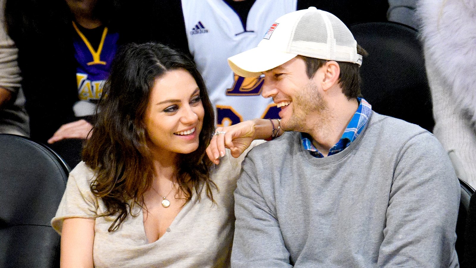 Mila Kunis and Ashton Kutcher attend a basketball game between the Oklahoma City Thunder and the Los Angeles Lakers at Staples Center in Los Angeles on December 19, 2014.
