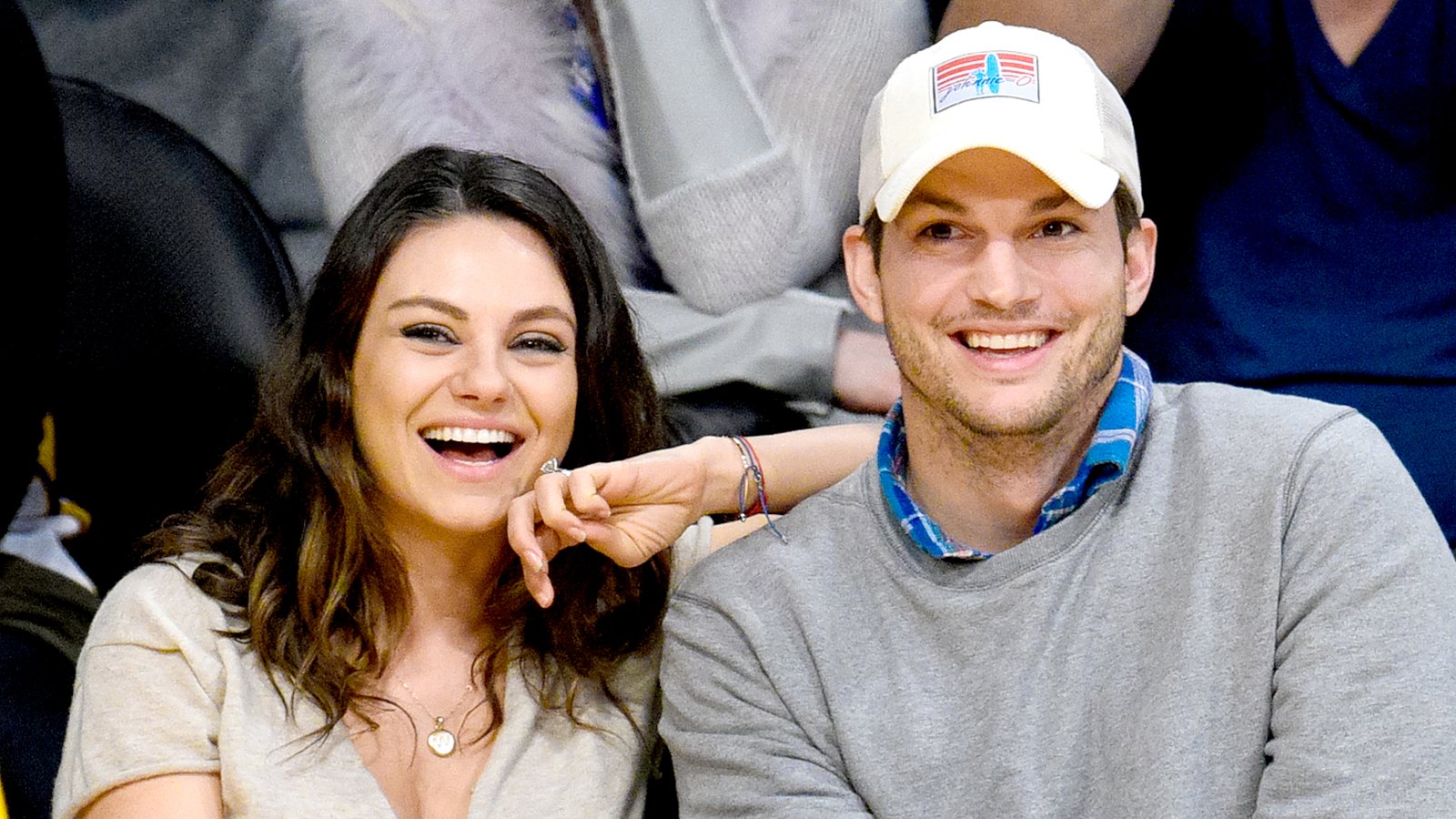 Mila Kunis and Ashton Kutcher attend a basketball game between the Oklahoma City Thunder and the Los Angeles Lakers at Staples Center on December 19, 2014 in Los Angeles, California.