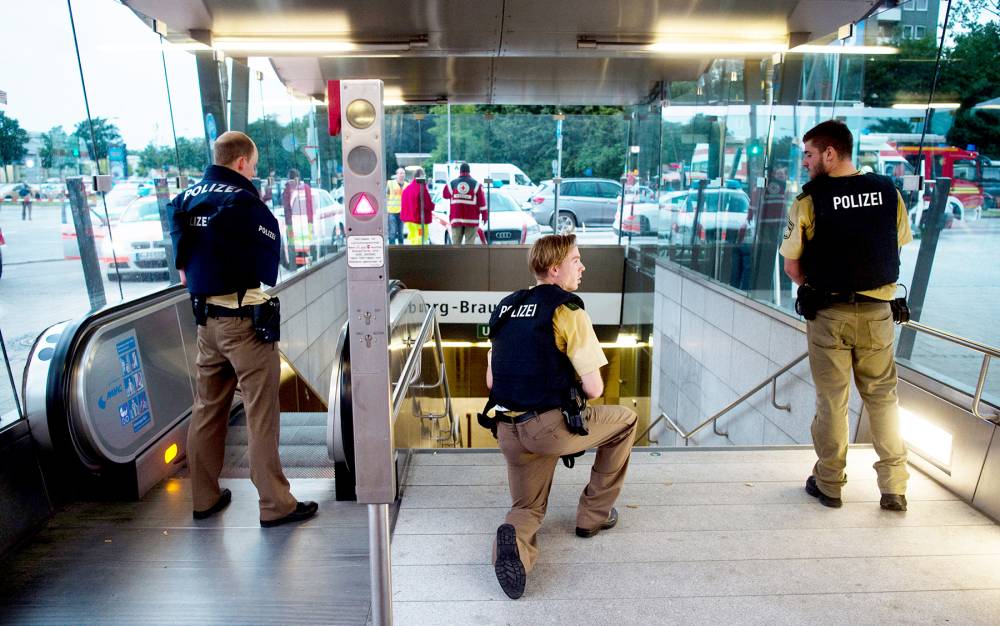 Police secures the entrance to a subway station near a shopping mall where a shooting took place on July 22, 2016 in Munich.