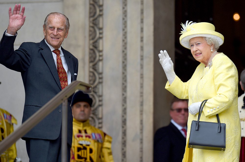 Queen Elizabeth II and Prince Phillip, Duke of Edinburgh, wave before entering the National Service of Thanksgiving as part of the 90th birthday celebrations for the Queen at St Paul's Cathedral on June 10, 2016 in London.