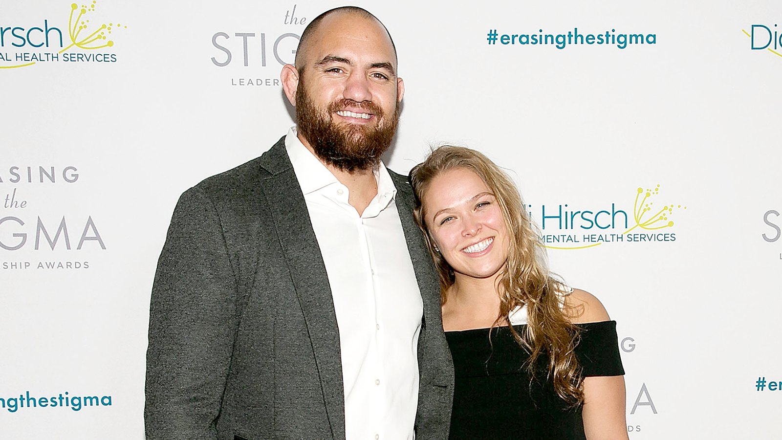 Travis Browne and Ronda Rousey arrive for the 20th Anniversary Erasing The Stigma Leadership Awards at The Beverly Hilton Hotel on April 28, 2016 in Beverly Hills, California.