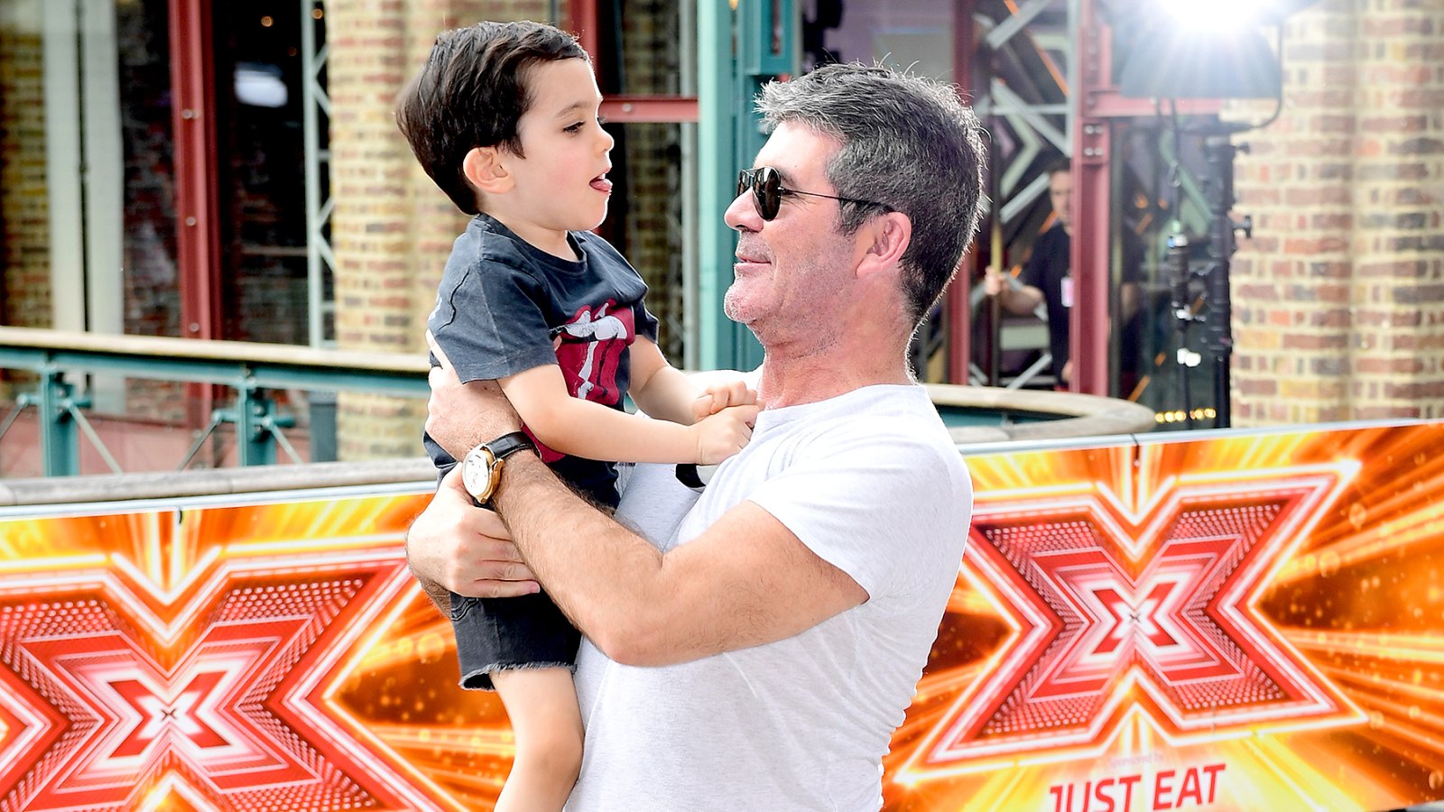 Simon Cowell and son Eric Cowell attending X Factor filming at Tobacco Dock, Wapping Lane, London.