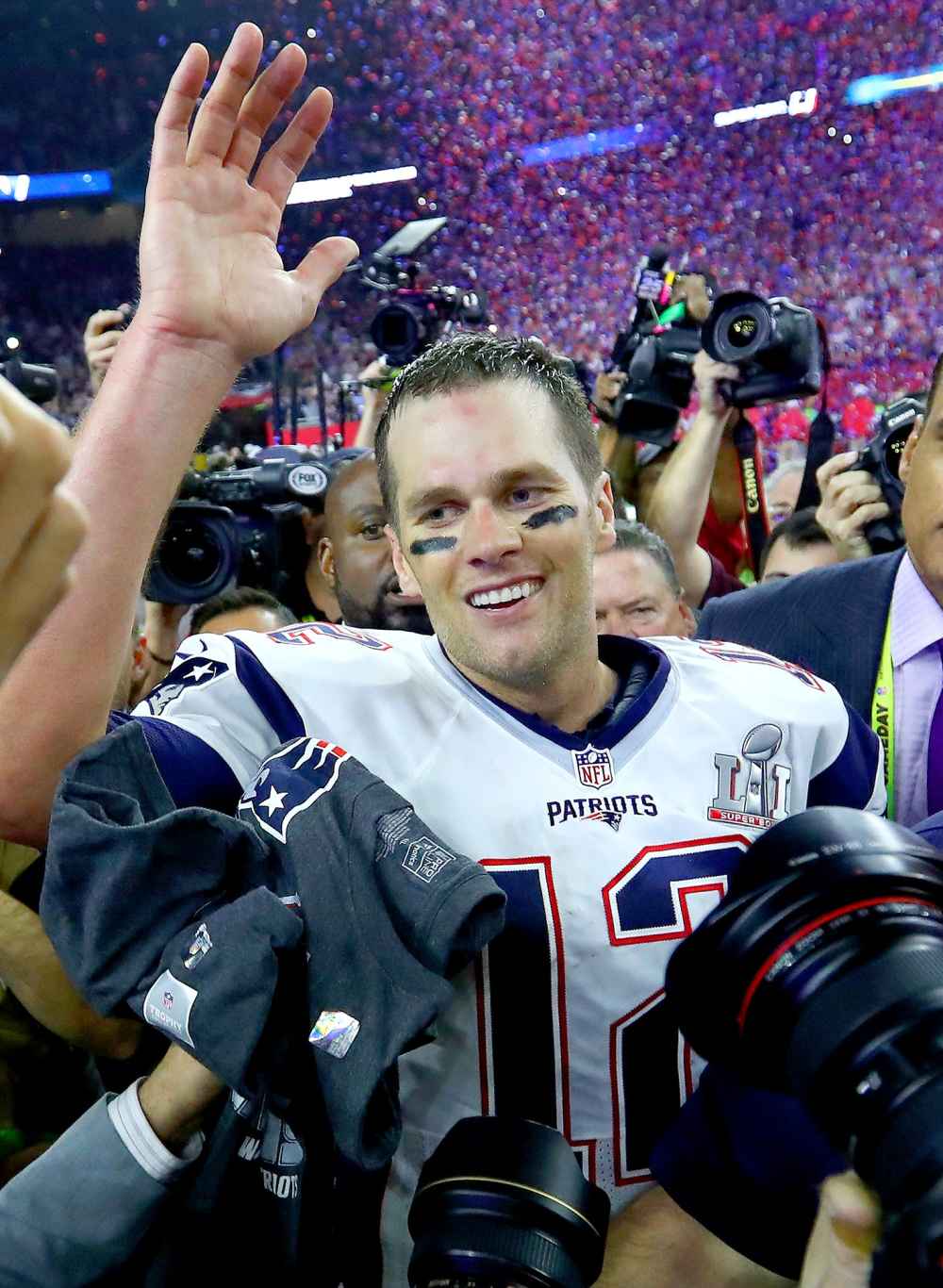 om Brady #12 of the New England Patriots celebrates after defeating the Atlanta Falcons 34-28 in overtime of Super Bowl 51 at NRG Stadium on February 5, 2017 in Houston, Texas.