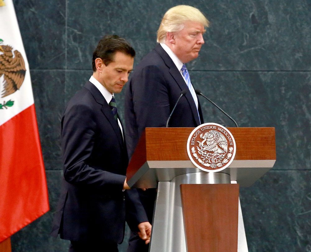 Donald Trump and Enrique Pena Nieto walk on stage for a joint conference in Mexico City, Mexico, on Wednesday, Aug. 31, 2016.