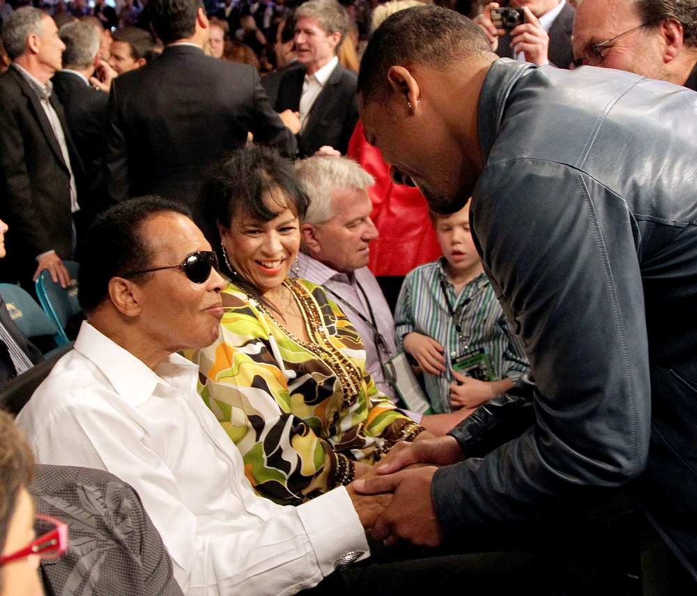 Muhammad Ali talks with actor Will Smith before the start of the Floyd Mayweather Jr. and Shane Mosley welterweight fight at the MGM Grand Garden Arena on May 1, 2010 in Las Vegas, Nevada.