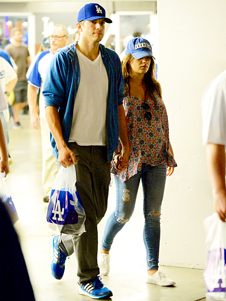 Pregnant Mila Kunis Wears Loose Tank, Skinny Jeans to Dodgers Game