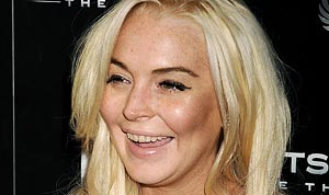 Lindsay Lohan Flashes Yellow, Decayed Teeth on Red Carpet | Us Weekly