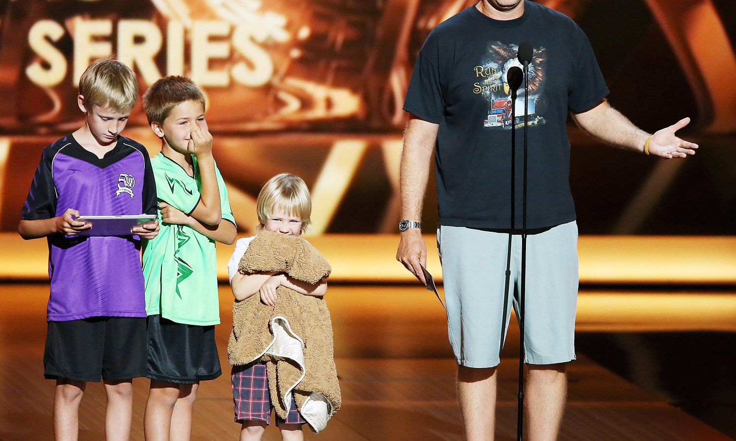 Will Ferrell and his children on stage at the 2013 Emmy Awards