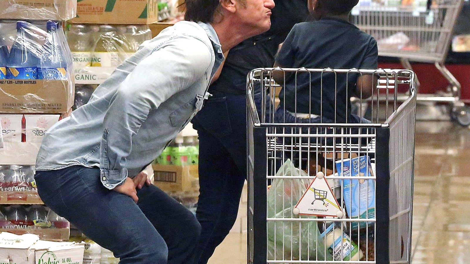 Sean Penn and Charlize Theron with her son Jackson at the store