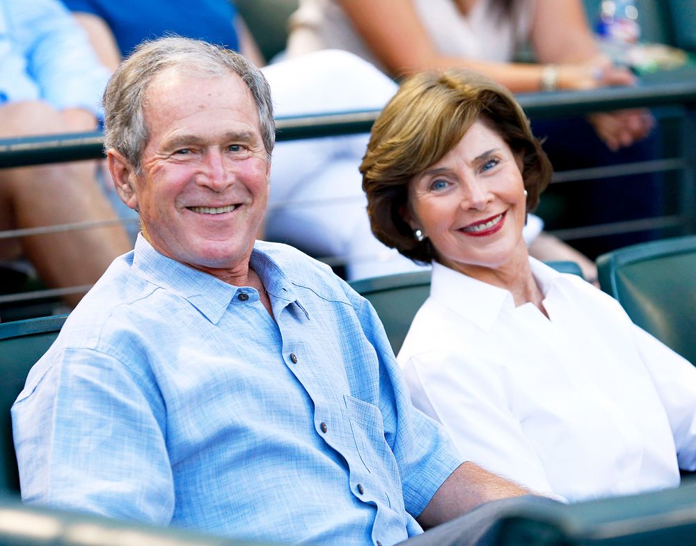 George W. Bush and Laura Bush during the game between the Seattle Mariners and the Texas Rangers at Globe Life Park in Arlington on September 19, 2015 in Arlington, Texas.