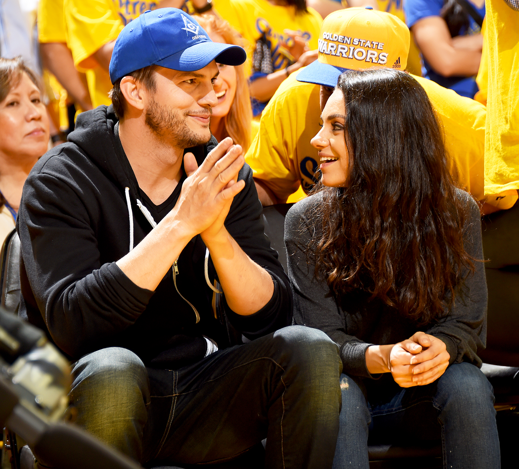 Ashton Kutcher and Mila Kunis attend Game Two of the 2016 NBA Finals at ORACLE Arena in Oakland, California.