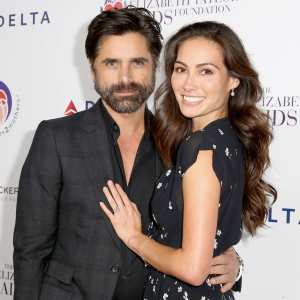 John Stamos (L) and Caitlin McHugh