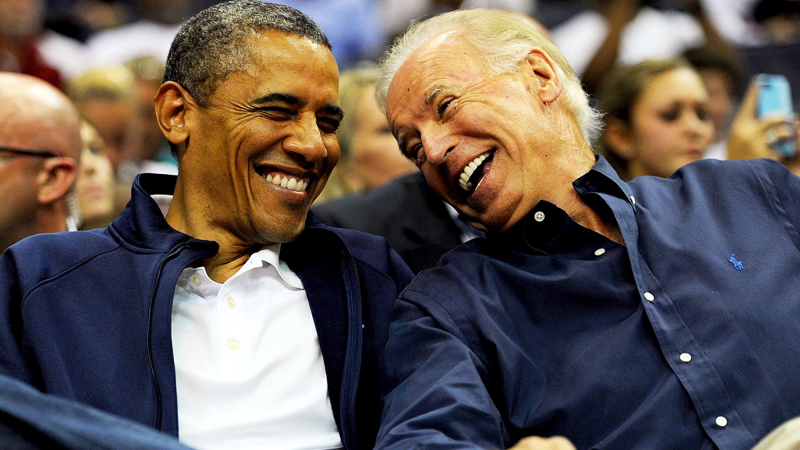 Barack Obama and Joe Biden attend the pre-Olympic exhibition basketball game at the Verizon Center on July 16, 2012 in Washington, DC.