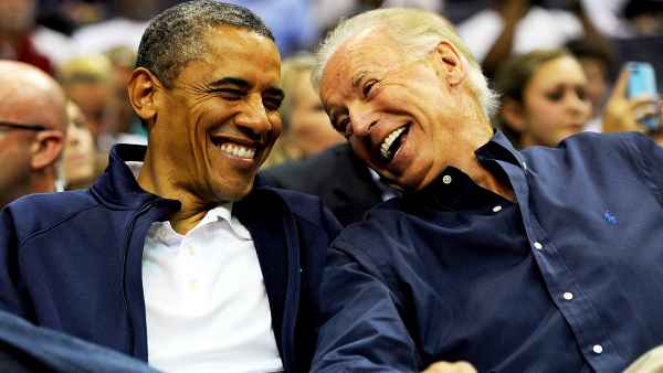 Barack Obama and Joe Biden attend the pre-Olympic exhibition basketball game at the Verizon Center on July 16, 2012 in Washington, DC.